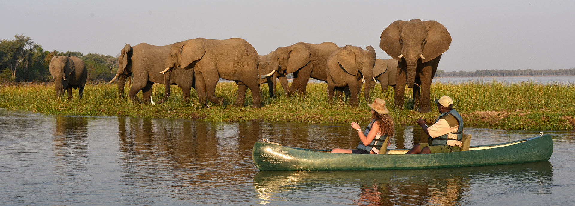 Sausage Tree Camp offers adventurous safari activities, including canoeing on the Zambezi River