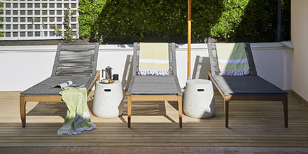 Sun loungers next to a pool at a luxurious private hotel in Cape Town
