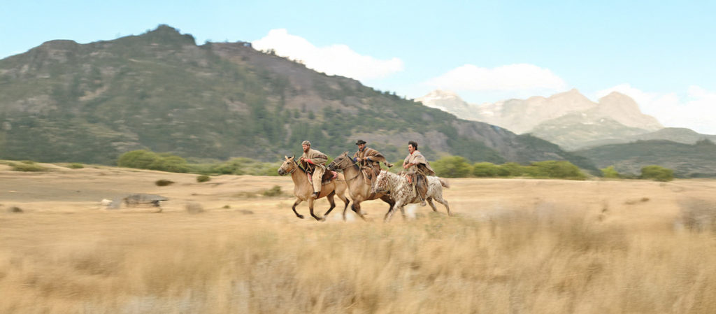 Gauchos Riding Across The Plains of Argentina