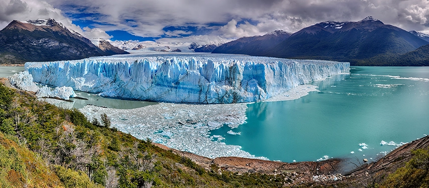 Perito Moreno Glacier spilling into turquoise waters in Los Glaciares National Park, a dramatic highlight of Patagonia in Argentina.