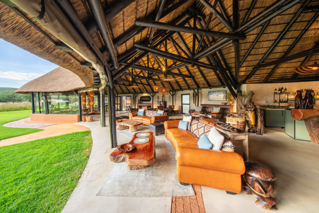 Bar and lounge area beneath the thatched lapa at Okonjima Luxury Bush Camp