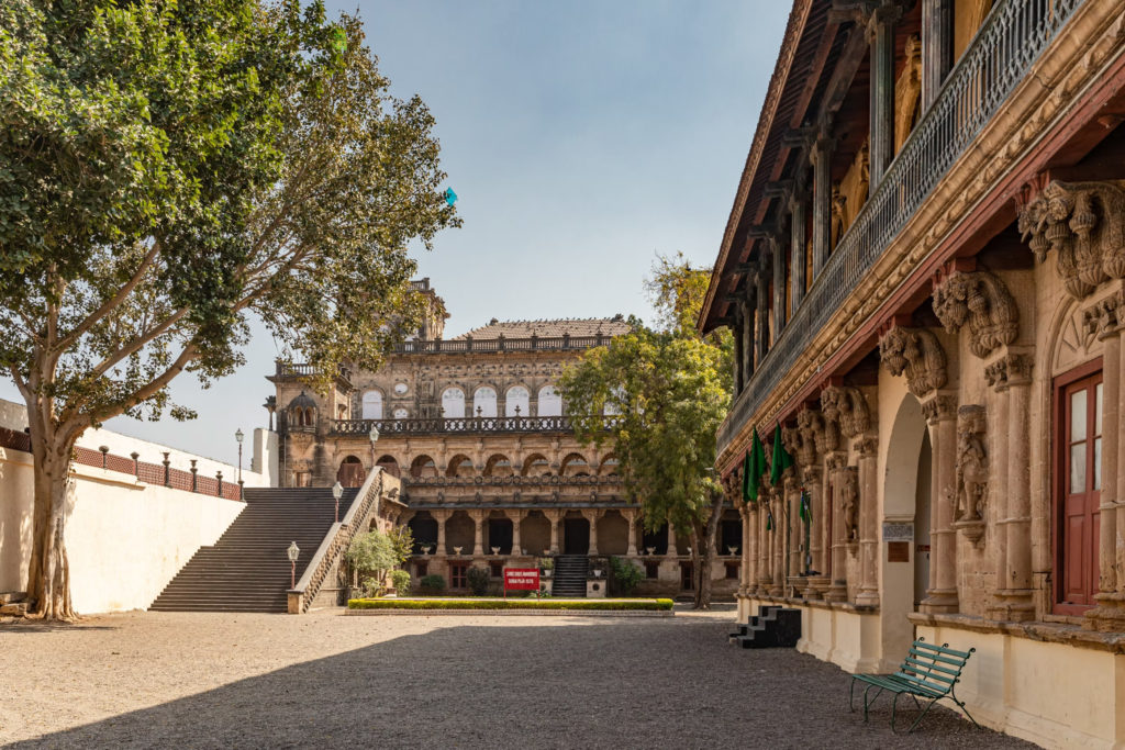 Ornately carved stone courtyard and staircase at a Gondal palace