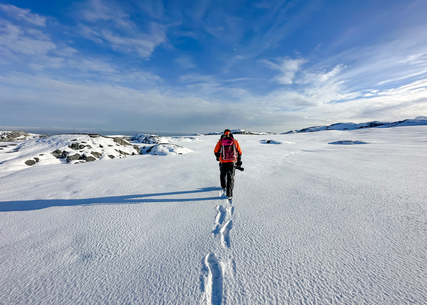 Expedition Guide hiking across snow, Yalour Islands, Antarctica