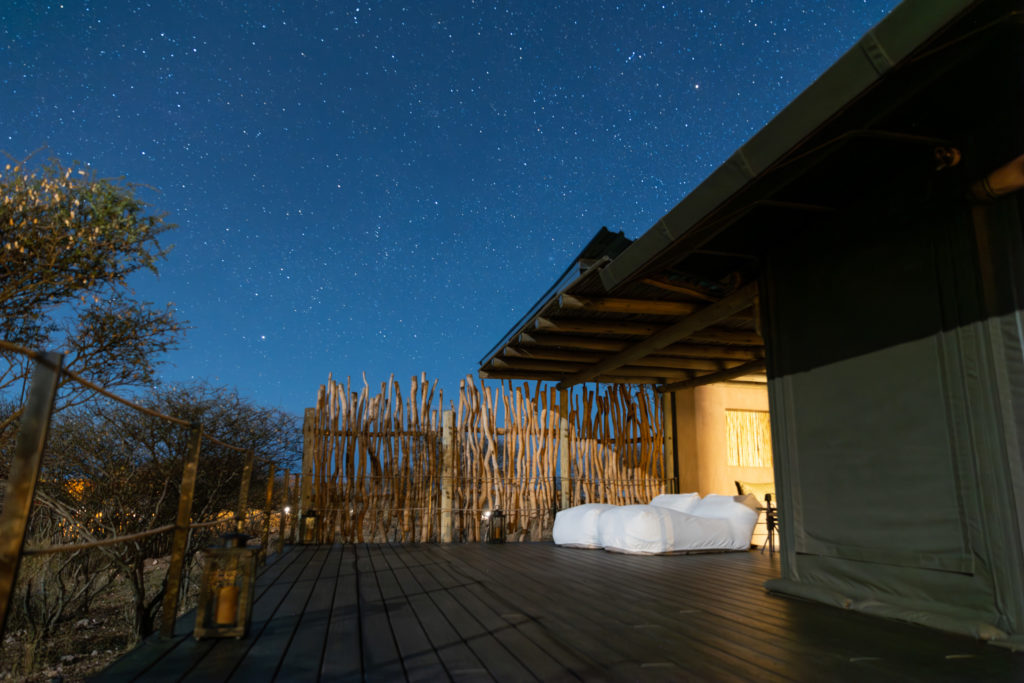 A private suite deck beneath a star-filled Namibian night sky