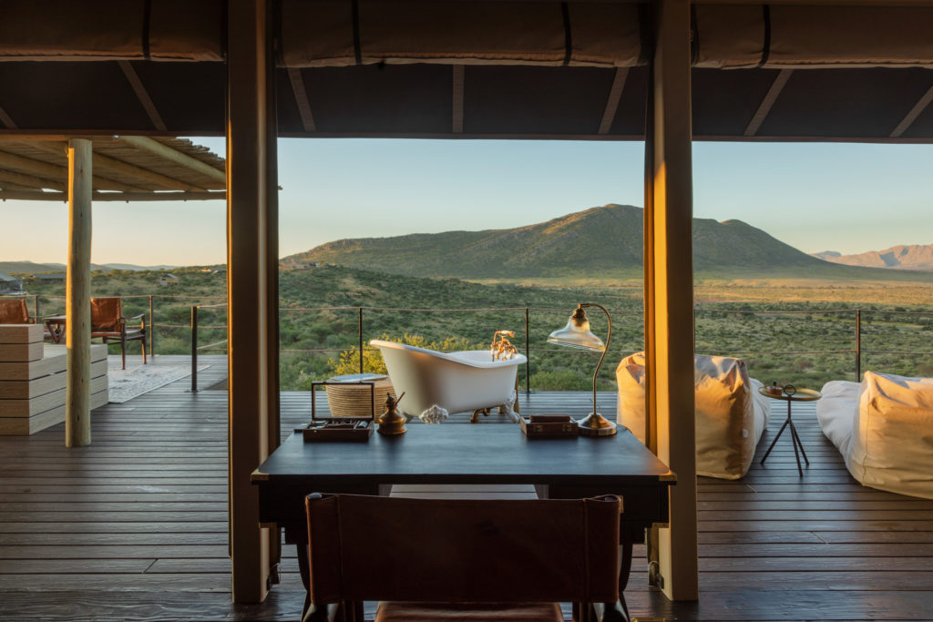 A clawfoot bathtub on the suite's deck faces the surrounding hills