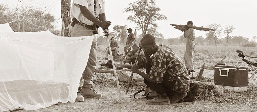 Staff pitching a sleet tent in Zambia's South Luangwa National Park