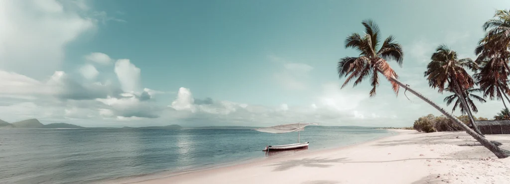 A traditional sailing boat lies on a deserted beach in the Bazaruto Archipelago in Mozambique.